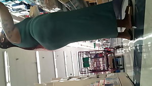 Thick tatted ebony MILF flaunts big ass in green dress. Prt2