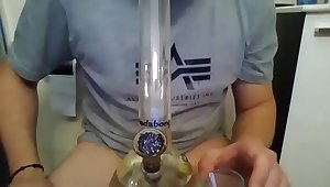 Smoking a bong and playing with cum