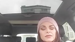 Gorgeous brunette Cougar smoking sexy in car