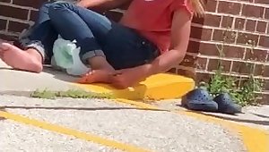 Homeless girl picking toe jam from her feet foot fetish