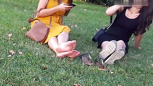 Teen relaxing dirty feets with upskirt in public