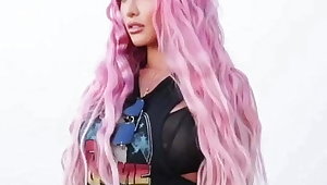 Nayali Eva Marie with pink hair and tight black pants