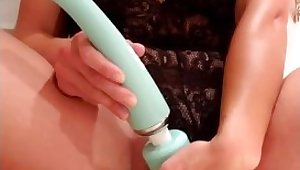 Sexy brunette pleasures pussy with vibrator