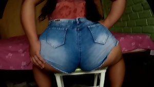 PAWG Latina showing her butts in a chair